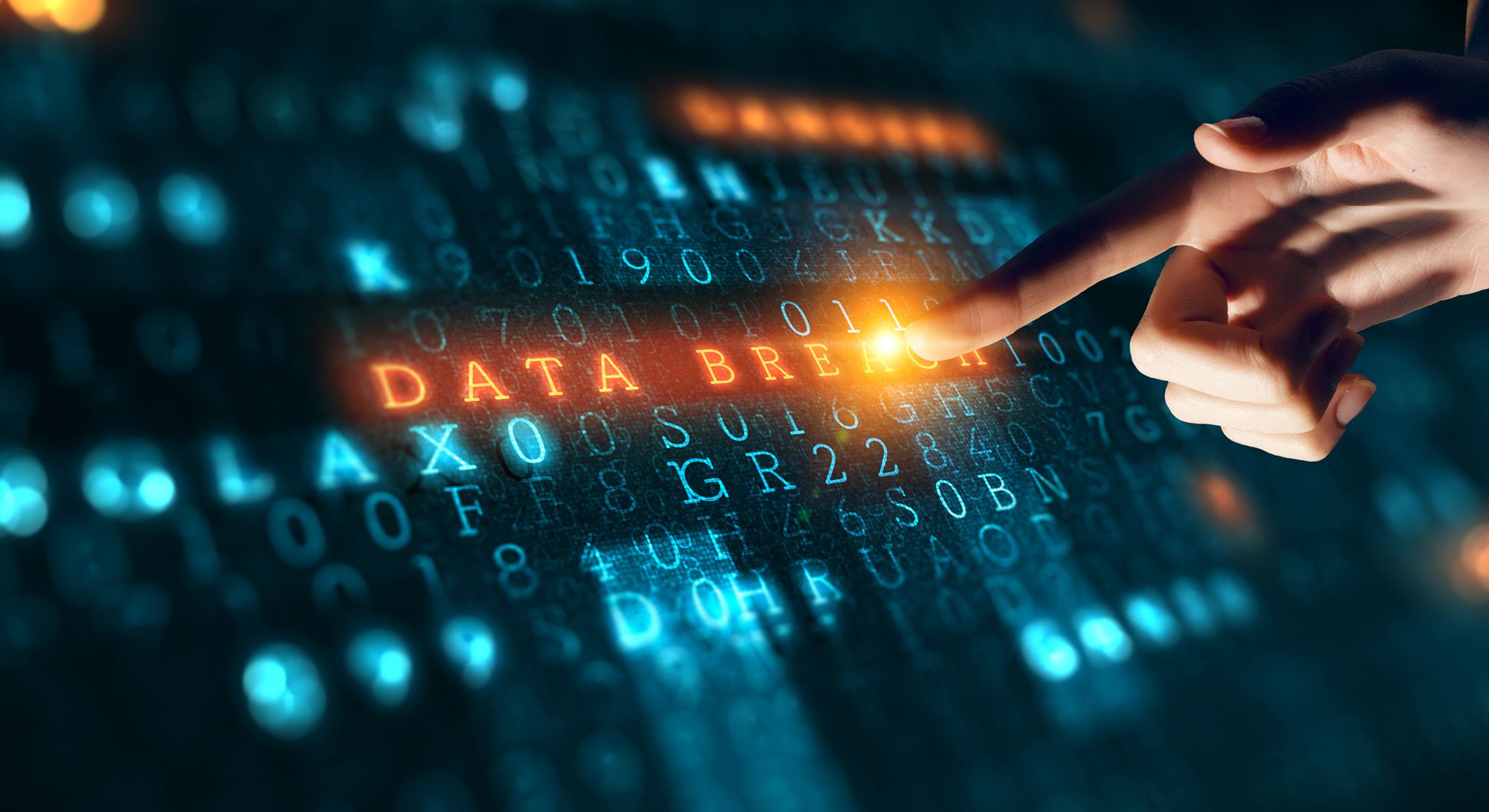 A hand touching a screen saying data breach