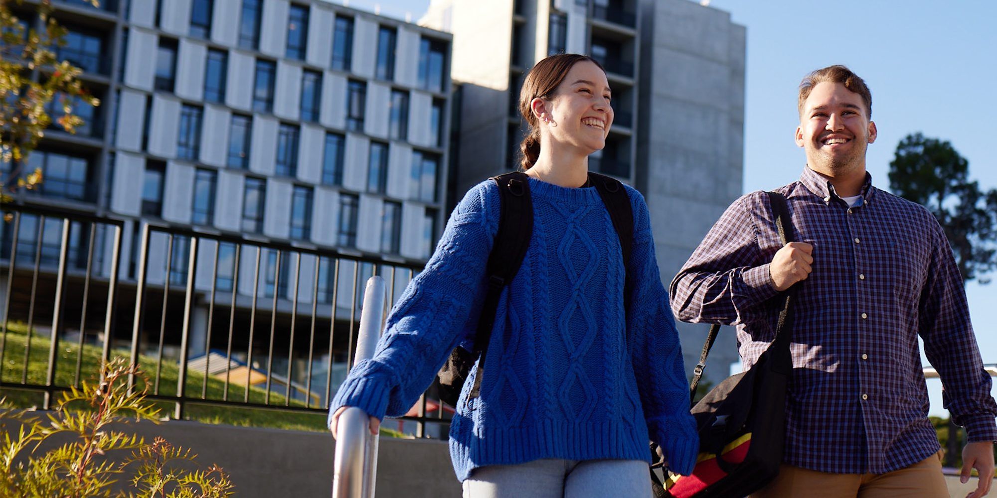 Students walking in front of the medical school
