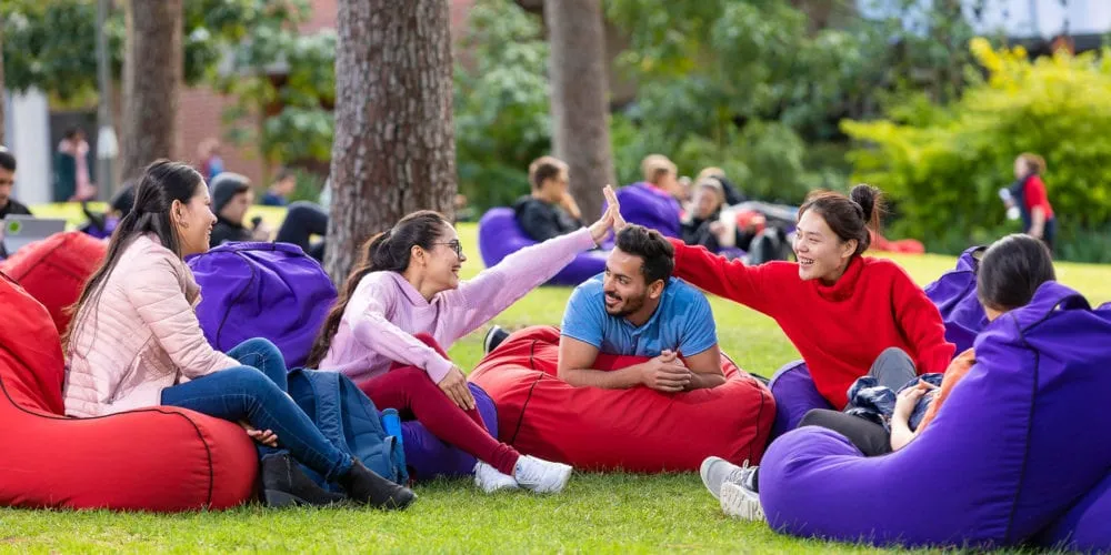 Five students sitting on bean bags at Curtin campus