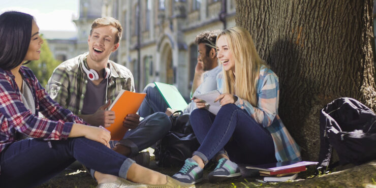 Group of students sat outside talking