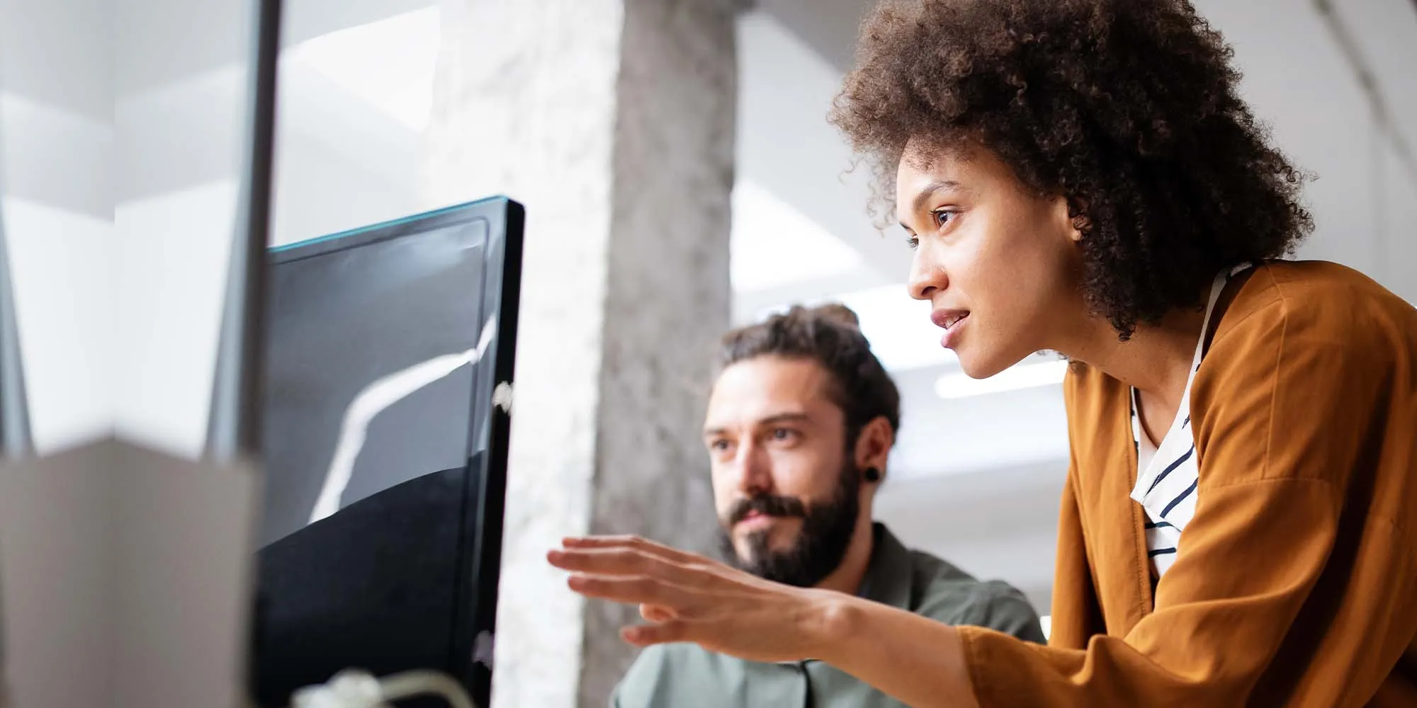 Digital marketing manager overlooking work