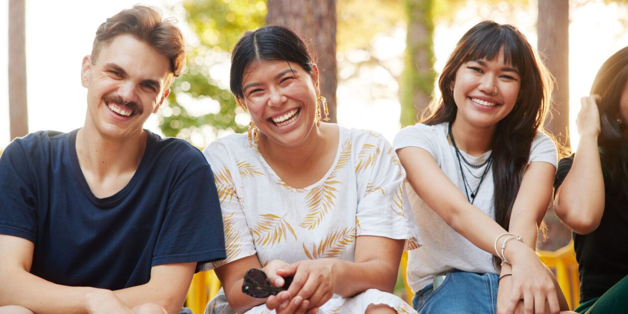 Curtin male and female students laughing together on Bentley campus
