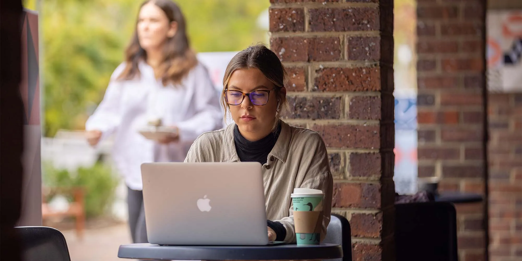 Student working on laptop at Concept Cafe at Curtin