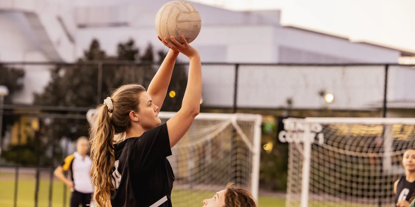 Students playing netball - play video