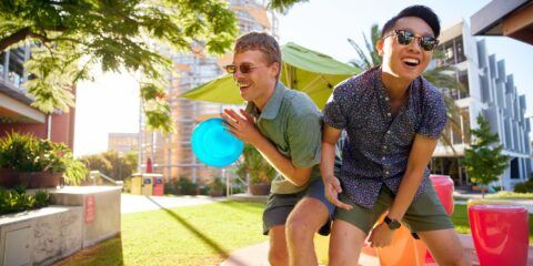 Students playing frisbee at Wesfarmers Court