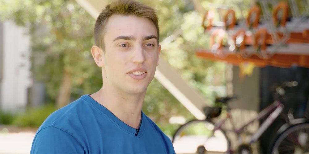 Male Curtin student outside - play video