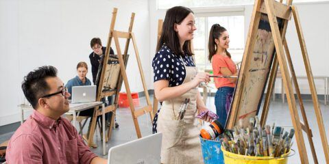 A group of students painting