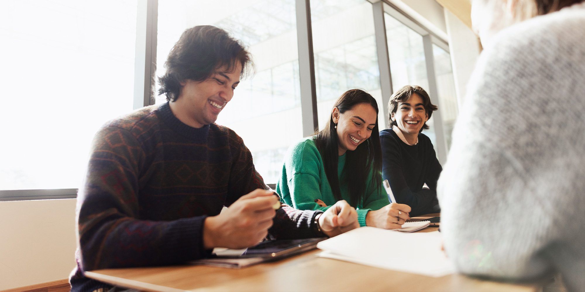 Group of students sitting around a table