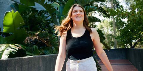 Female student walking on a bridge at Curtin Perth