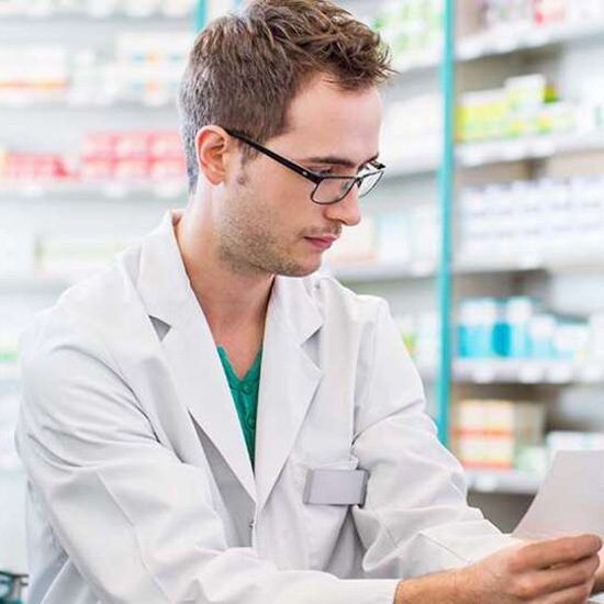 Pharmacy student holding a sample