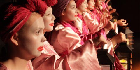 Actors lined up on stage