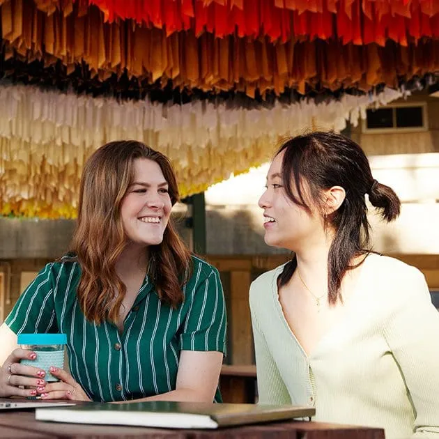 Two young students chatting