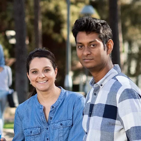 Two Indian students sitting on campus