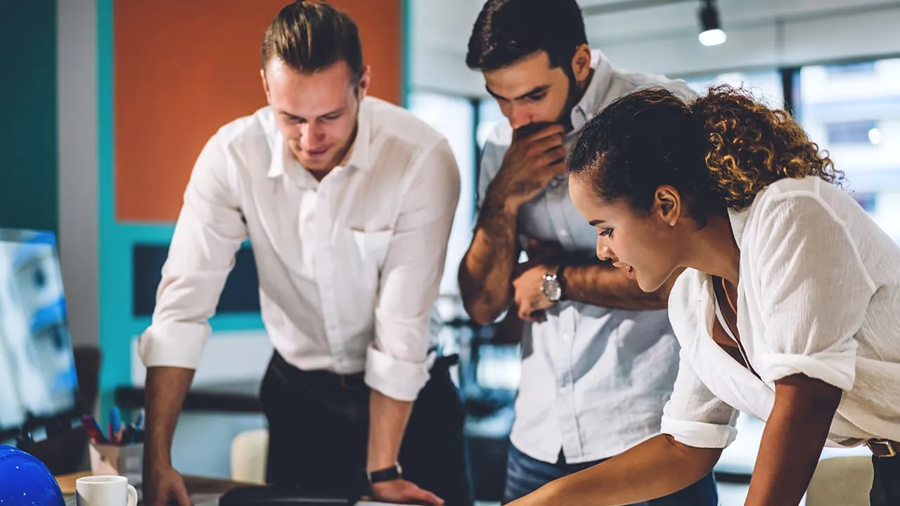 Group of professionals discussing a report