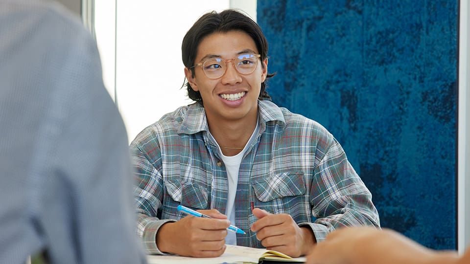 male student in a classroom