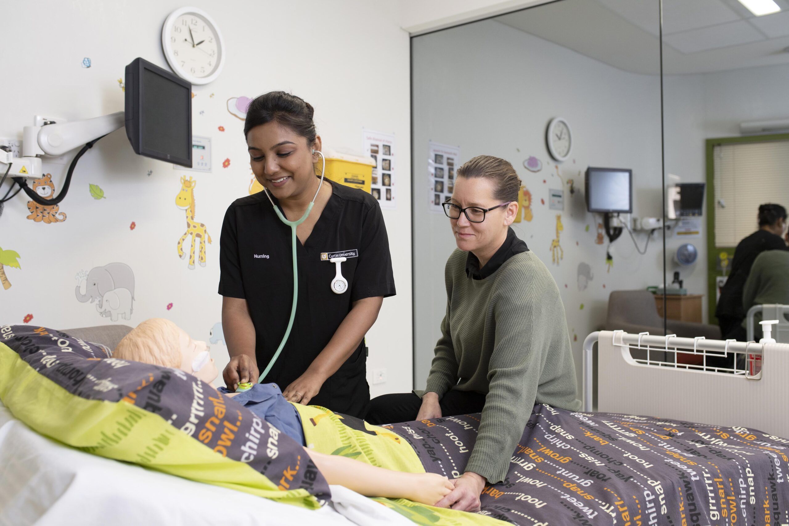 A nurse tending to a patient