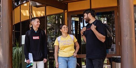 Indigenous students standing in front of CAS building