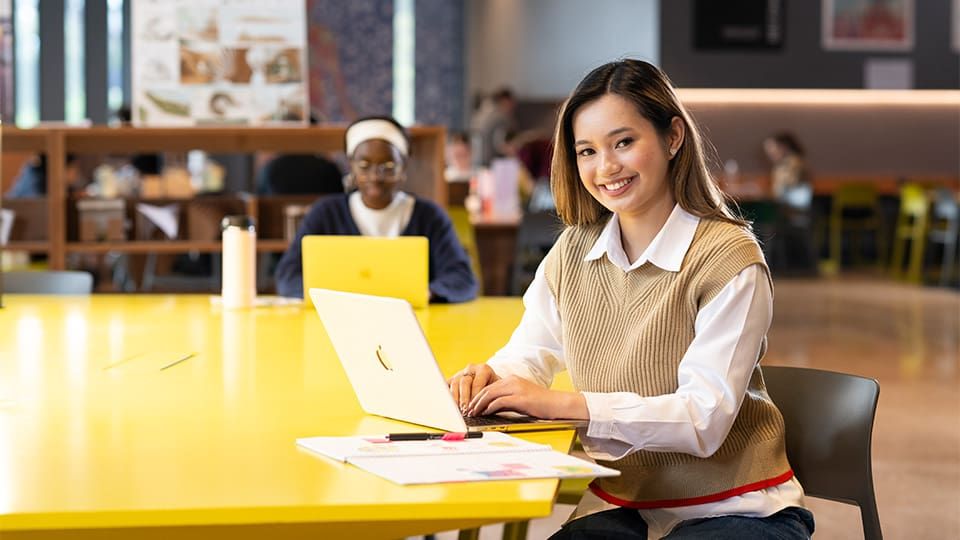 business student with laptop