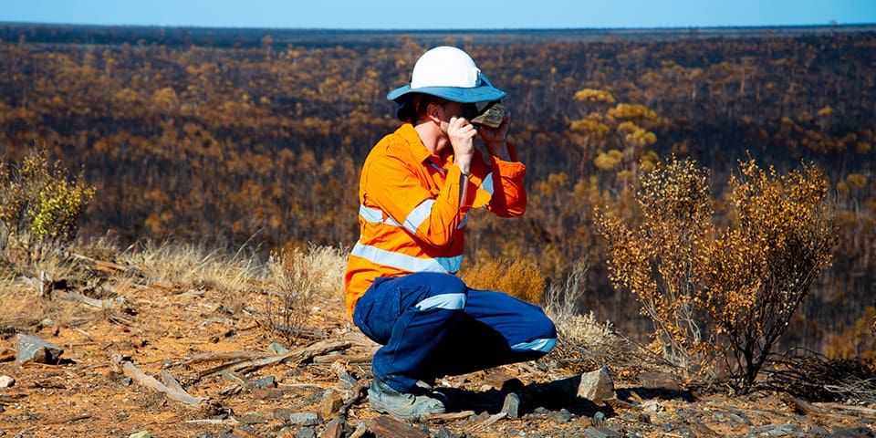 Earth Science student assessing rocks