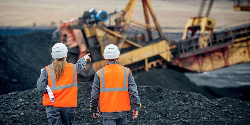 Mining surveyers on a mine site