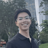 Bachelor of Pharmacy (Honours) smiling at the camera with a cityscape in the background.