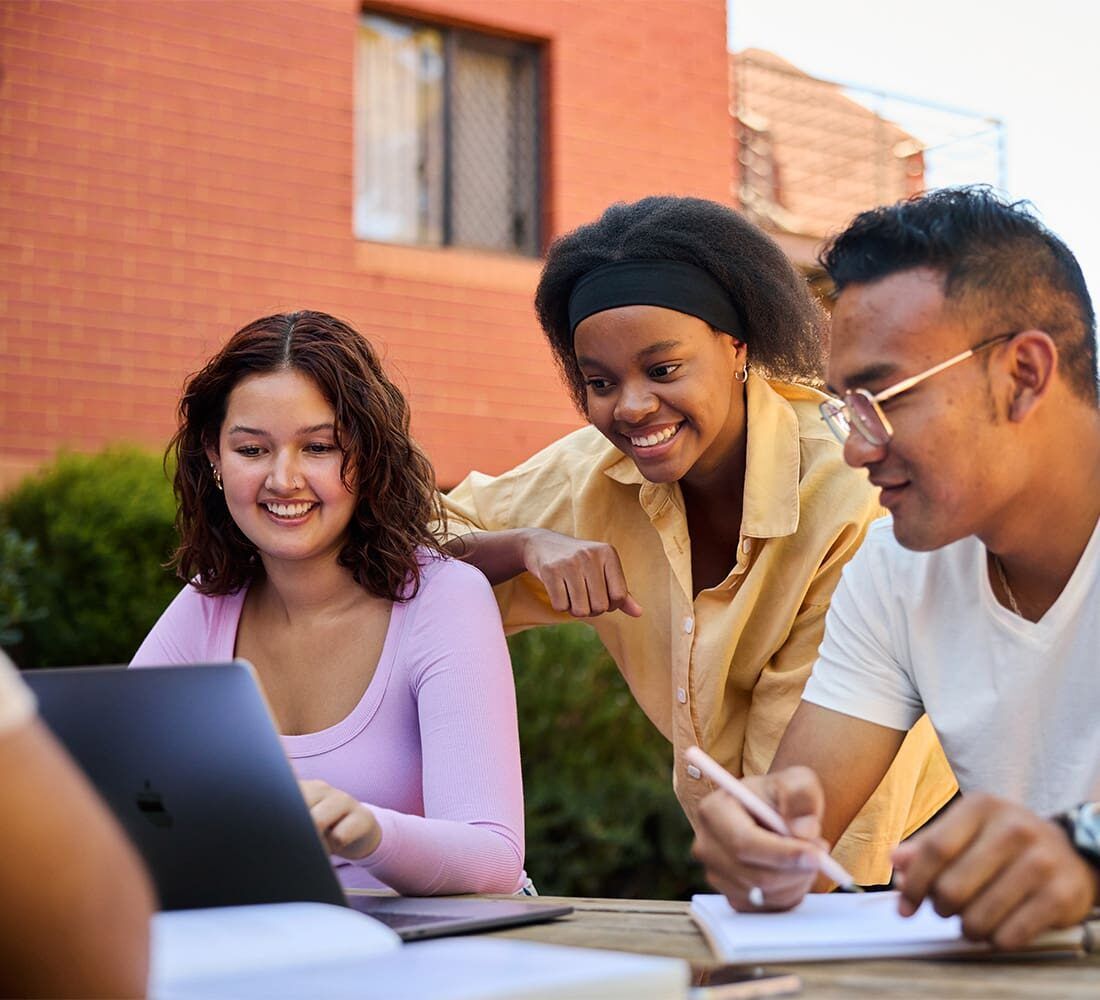 students looking at a laptop