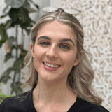 Bachelor of Science (Oral Health Therapy) student smiling to the camera