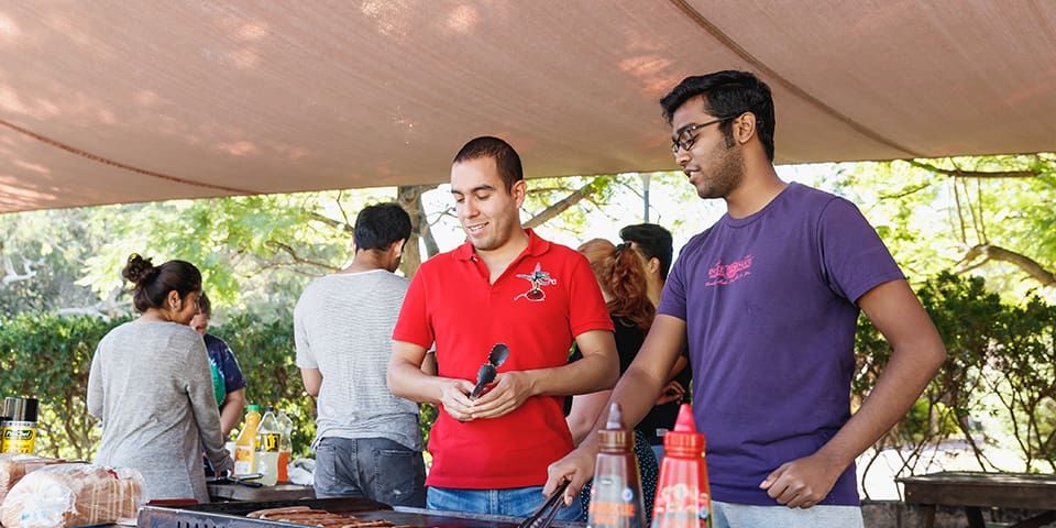 Two students at a barbeque
