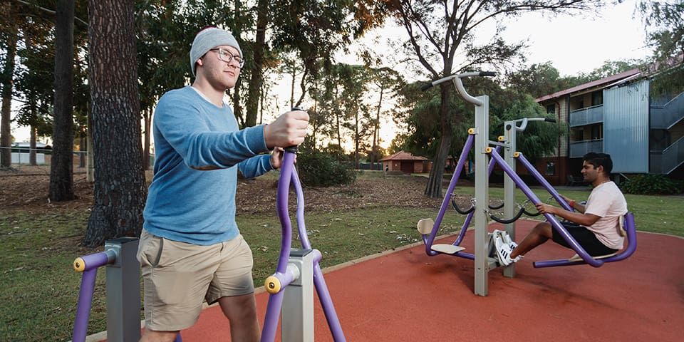 Students exercising outside the Guild House