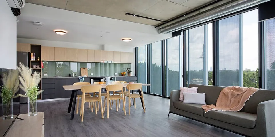 Example kitchen and living room in a shared accommodation at Twin Dolphin Hall
