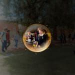 Abstract sphere in space, with a reflection of Kalgoorlie students