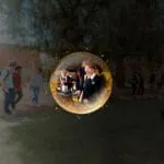 Abstract sphere in space, with a reflection of Kalgoorlie students