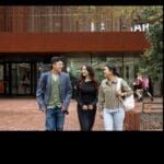 A group of students over 20 walking on Curtin campus.