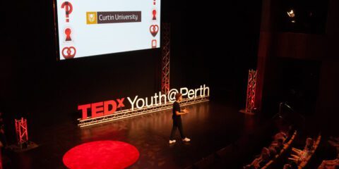 Presenter on stage at TEDx Youth@Perth